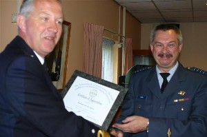 Chapter President Commander Willem Voogt, RNLN (l), hands a certificate of appreciation to Colonel Loek Smits, RNLAF, commander of the JCG, for his presentation on the Joint CIS Group.
